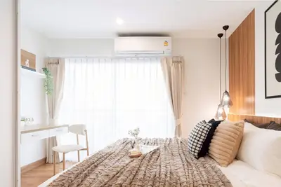 Bright and cozy bedroom with modern decor and natural light