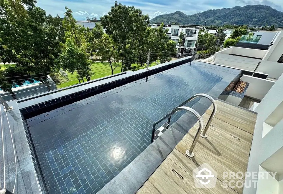 Luxurious rooftop infinity pool with stunning mountain views and modern architecture