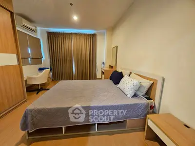 Spacious bedroom with modern furnishings and ample natural light