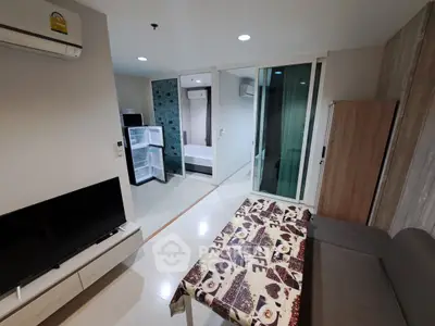 Modern living room with cozy sofa and stylish decor in a contemporary apartment.