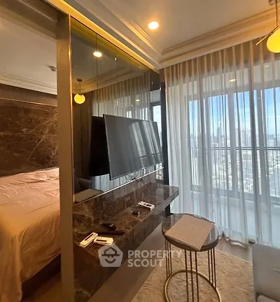 Luxurious bedroom with city view and modern decor in high-rise apartment