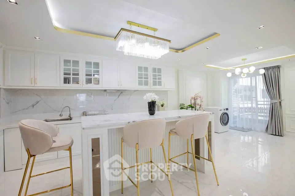 Luxurious modern kitchen with marble countertops and elegant lighting
