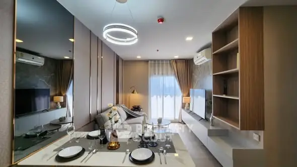 Modern living room with elegant dining setup and stylish decor