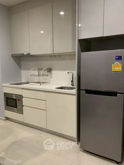 Modern kitchen with sleek cabinetry and stainless steel appliances