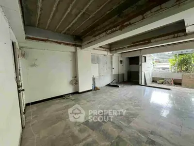 Spacious open-plan interior with potential for customization and natural light.
