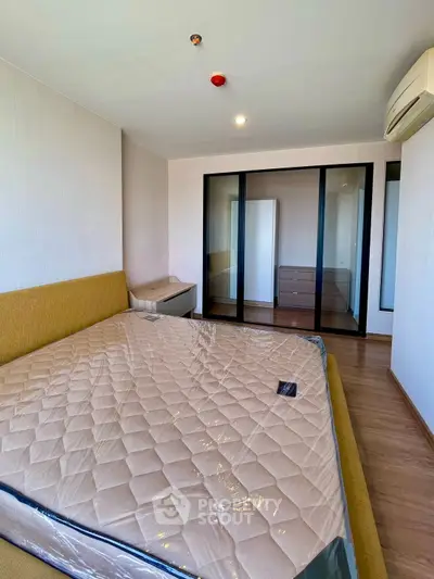 Spacious bedroom with modern design and ample natural light