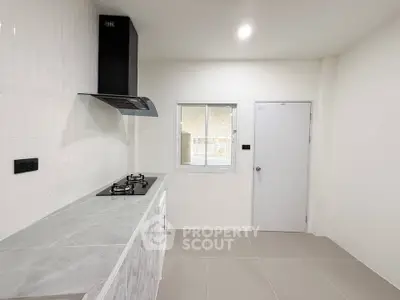 Modern kitchen with sleek gas stove and minimalist design