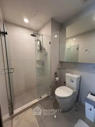 Modern bathroom with glass shower and sleek fixtures