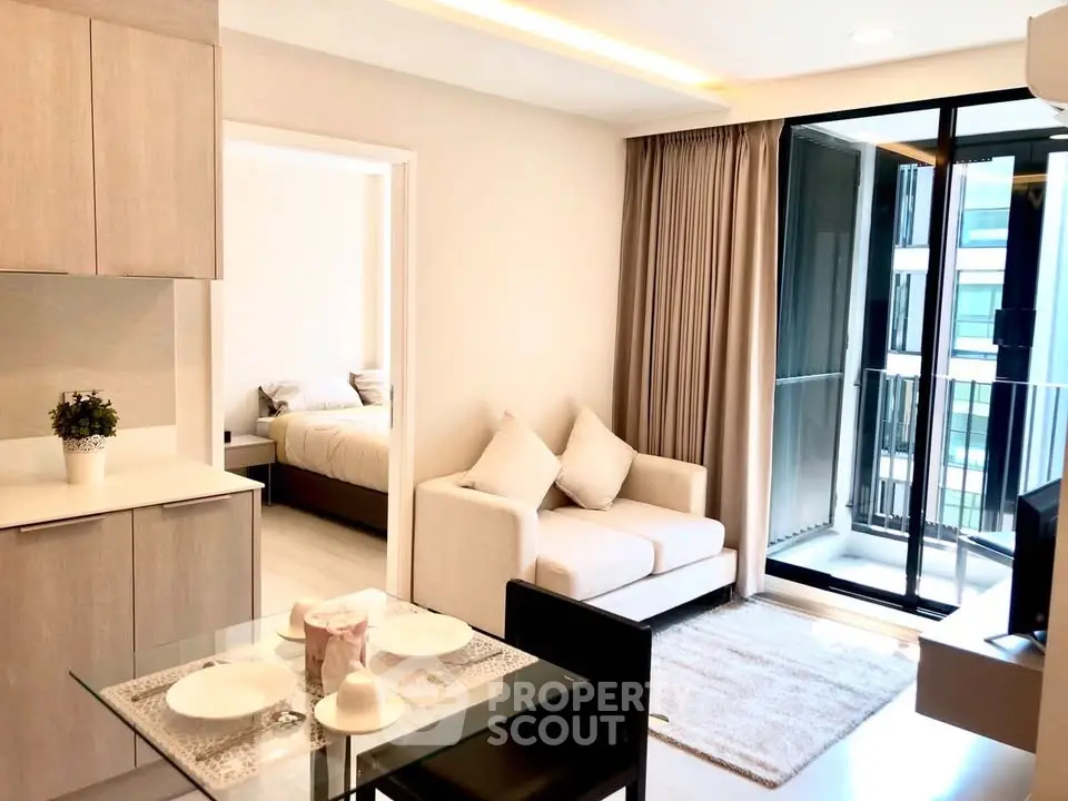 Modern apartment living room with balcony and bedroom view