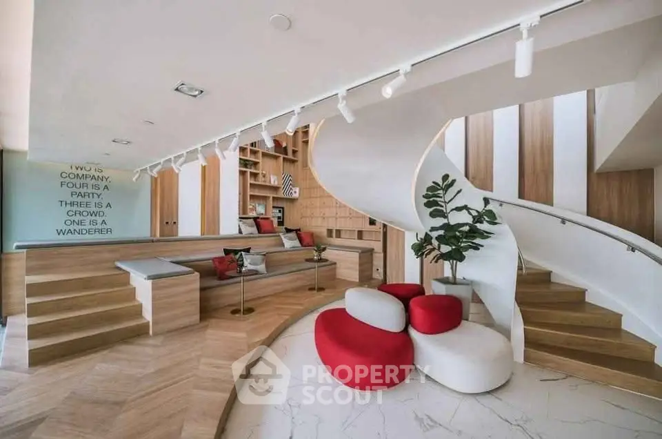 Modern living room with spiral staircase and stylish seating area