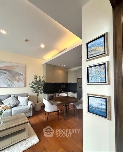 Modern open-layout living room with cozy seating and stylish kitchen area, perfect for urban living.