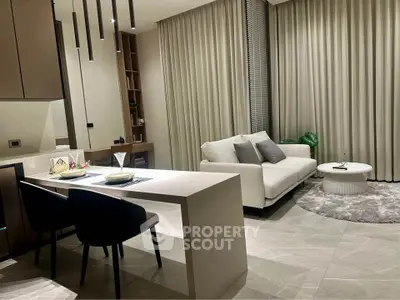 Modern living room with elegant decor and open kitchen layout
