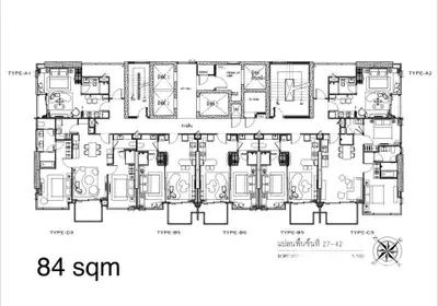 Detailed floor plan of a modern apartment complex with multiple unit types and 84 sqm area.