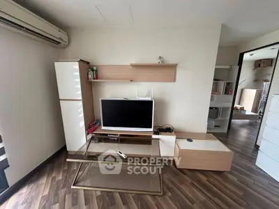 Modern living room with sleek furniture and wooden flooring