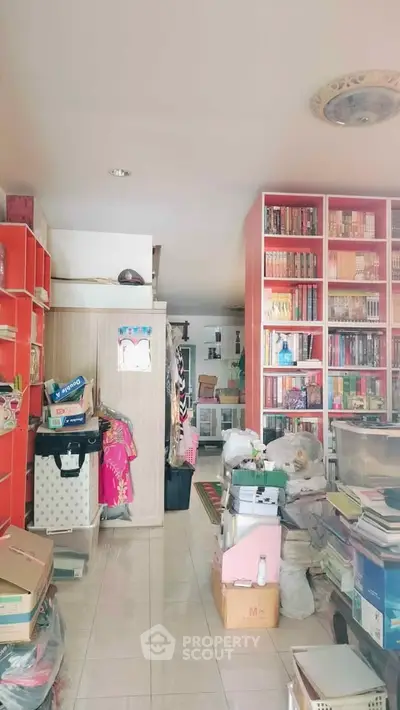 Spacious interior with vibrant red shelving and ample storage space, ideal for organizing and displaying items.