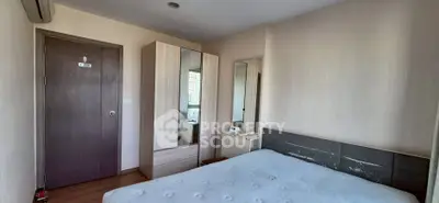 Cozy bedroom with modern wardrobe and large window for natural light