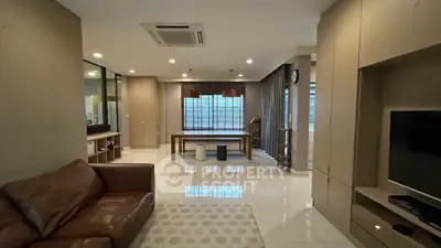 Spacious modern living room with leather sofa and stylish decor