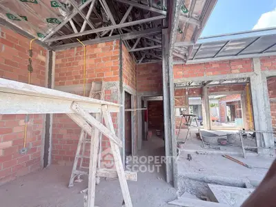 Under-construction property showcasing brick walls and metal framework, ideal for customization.