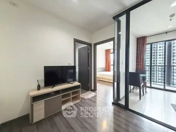 Modern apartment interior with open living room and balcony view