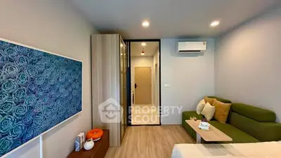 Modern bedroom with stylish decor and air conditioning in a cozy apartment.