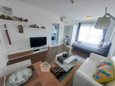 Modern studio apartment with open layout, featuring cozy living area and stylish decor.