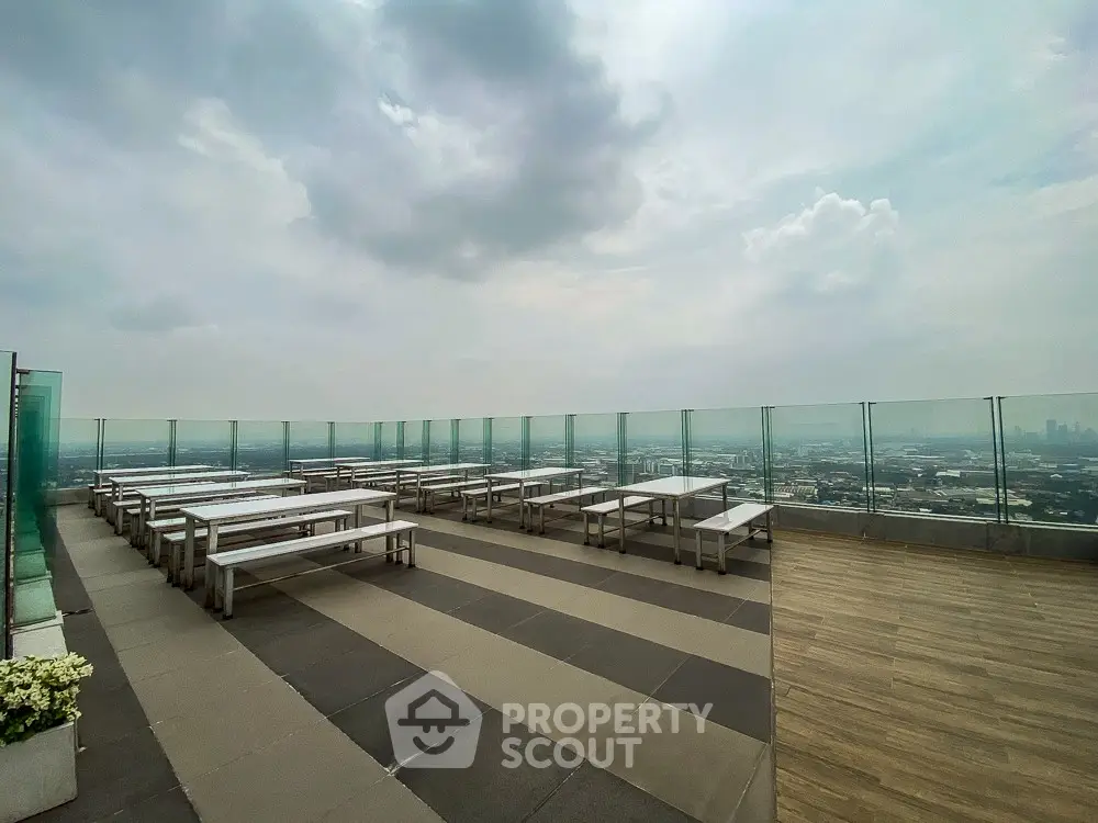 Stunning rooftop terrace with panoramic city views and modern seating area.