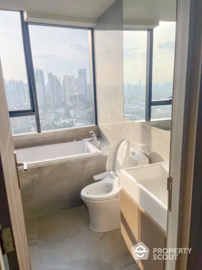 Luxury bathroom with city view featuring bathtub and modern fixtures