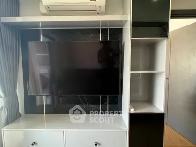 Modern living room with sleek TV unit and air conditioning