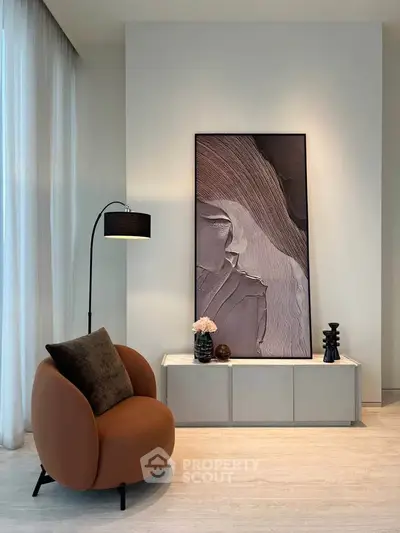 Elegant modern living room with stylish armchair and abstract art decor