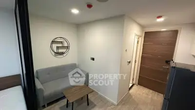Modern compact living room with minimalist decor and cozy seating area