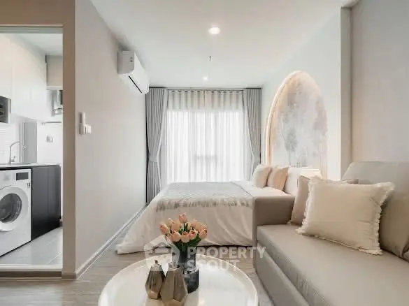 Modern studio apartment with cozy living area and stylish decor