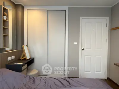 Modern bedroom with sleek design and built-in closet