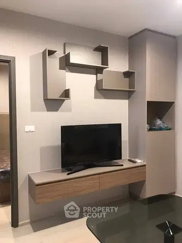 Modern living room with sleek TV unit and contemporary wall shelves