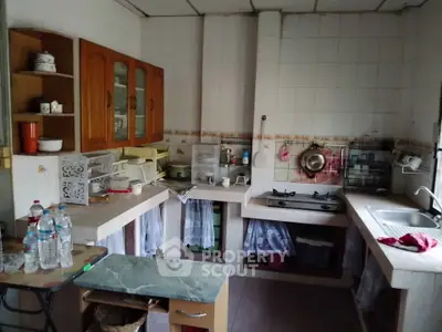 Charming kitchen with gas stove and ample storage in cozy home