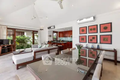 Spacious open-plan living and dining area with modern decor and garden view.