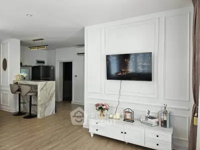 Stylish modern living room with wall-mounted TV and elegant decor