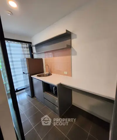 Modern kitchen with sleek cabinetry and stainless steel appliances