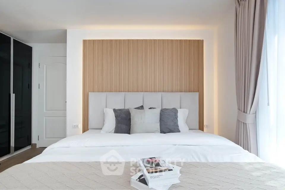 Elegant bedroom with modern design, featuring a cozy bed, stylish headboard, and soft lighting for a relaxing ambiance.
