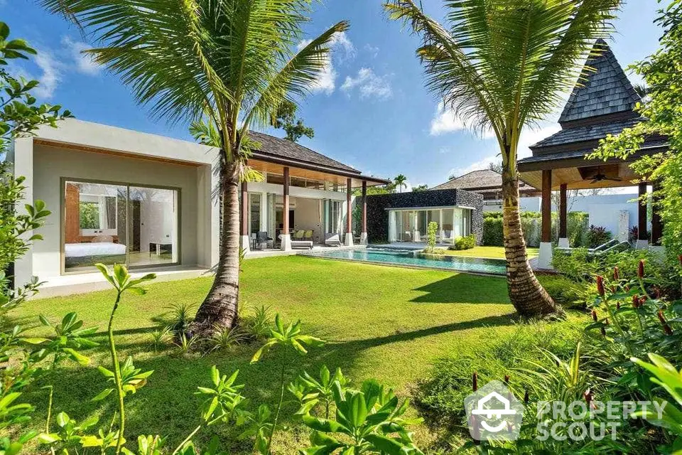 Luxurious tropical villa with private pool and lush garden, perfect for serene living.