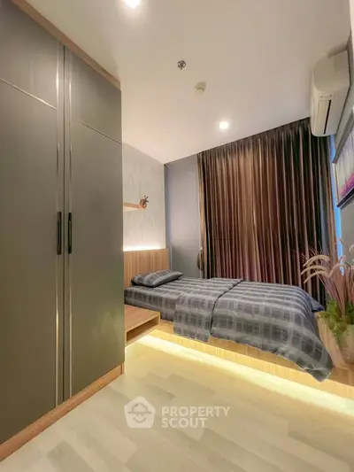 Modern bedroom with sleek wardrobe and ambient lighting