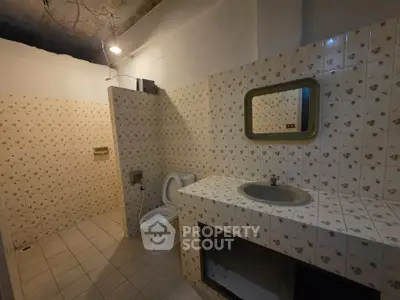 Spacious bathroom with vintage tile design and built-in sink