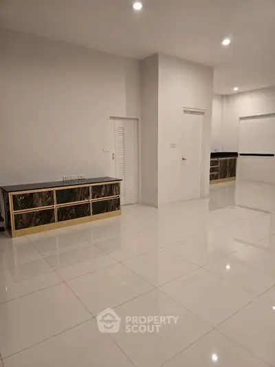 Spacious modern interior with sleek white tiles and minimalist design