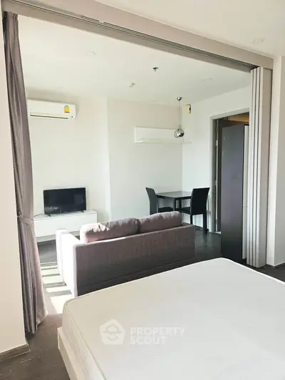 Modern studio apartment with open layout and sleek furnishings