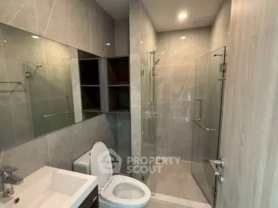 Modern bathroom with sleek glass shower and elegant tile design