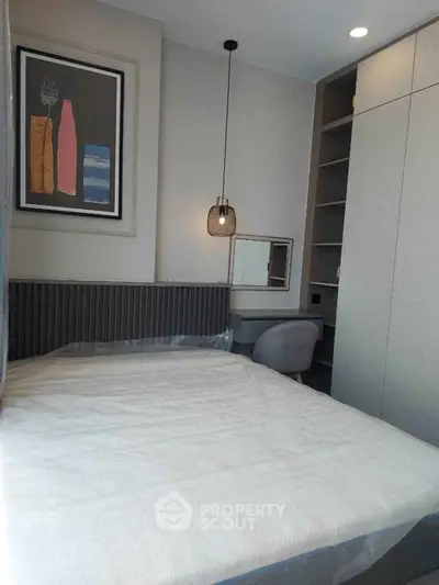 Modern bedroom with stylish decor and built-in storage solutions