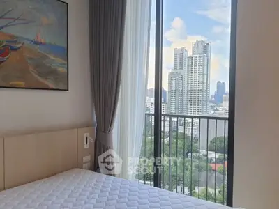 Modern bedroom with stunning city view from large window, featuring elegant decor and natural light.