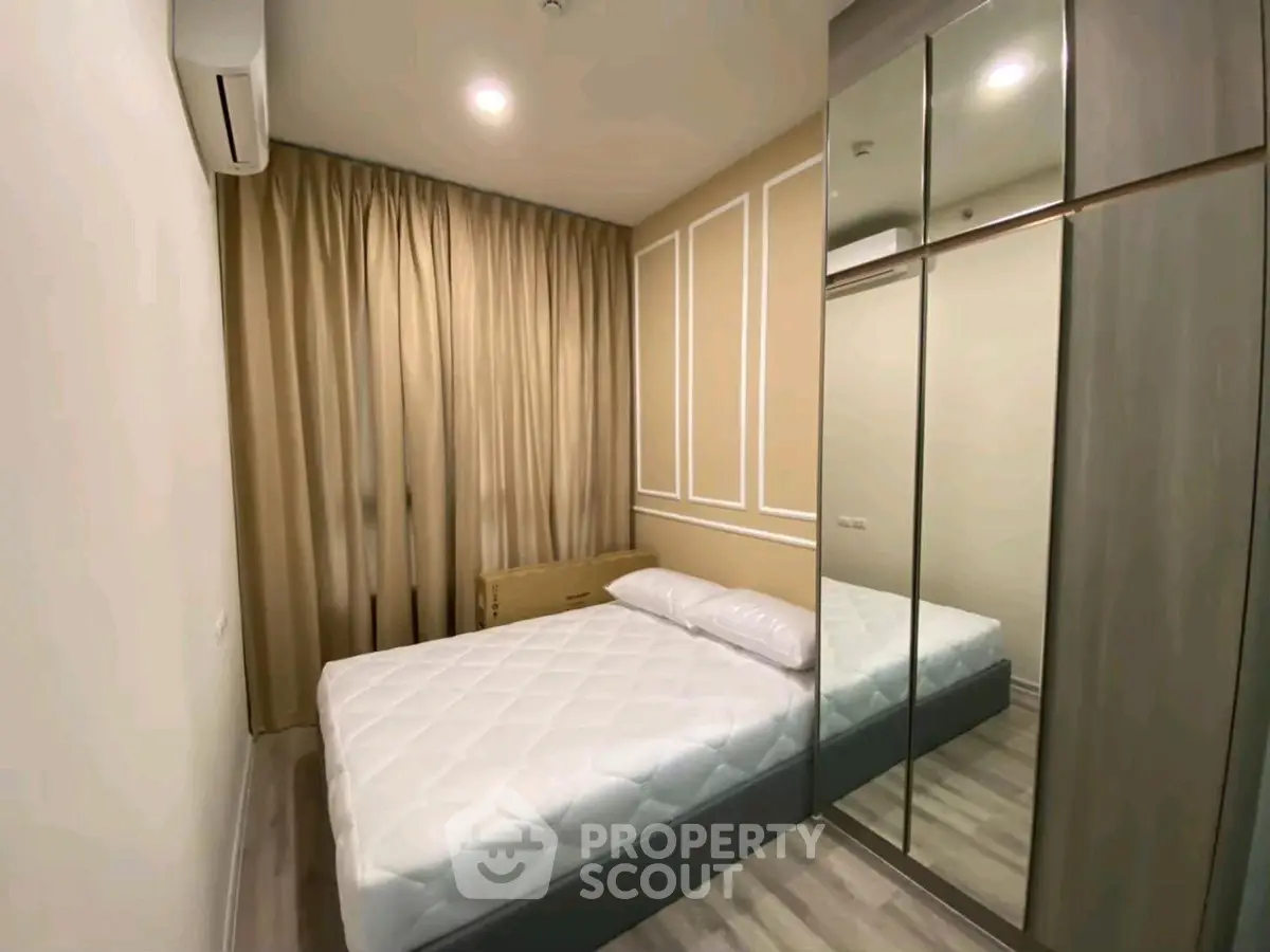 Cozy modern bedroom with mirrored wardrobe and elegant decor