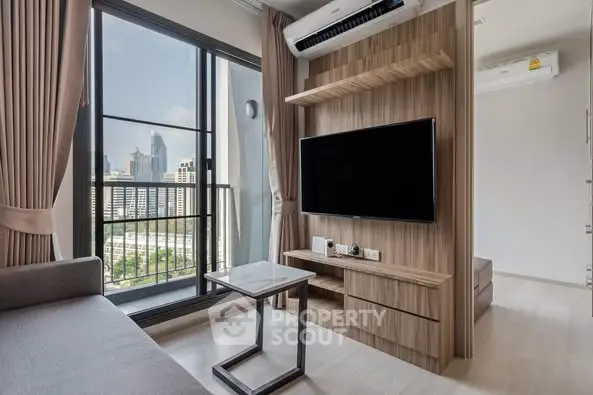 Modern living room with city view and sleek wooden TV unit