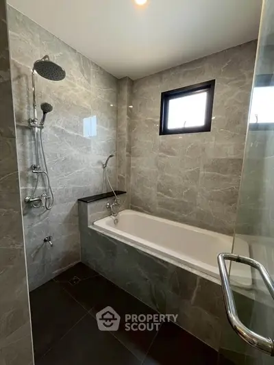 Luxurious modern bathroom with elegant marble tiles and sleek fixtures