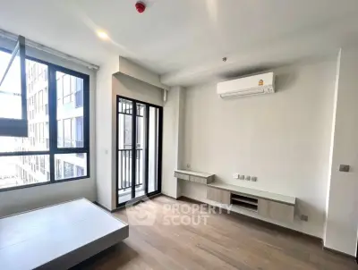 Modern unfurnished apartment with large windows and air conditioning